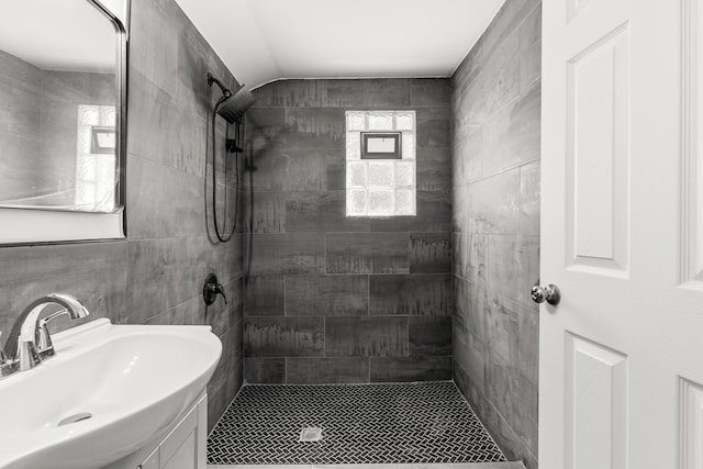 16224 Tuller St, Detroit, MI 48221 - bathroom with a sink, a tile shower, tile walls, and lofted ceiling