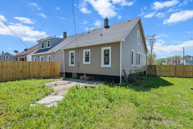 rear view of house with a chimney