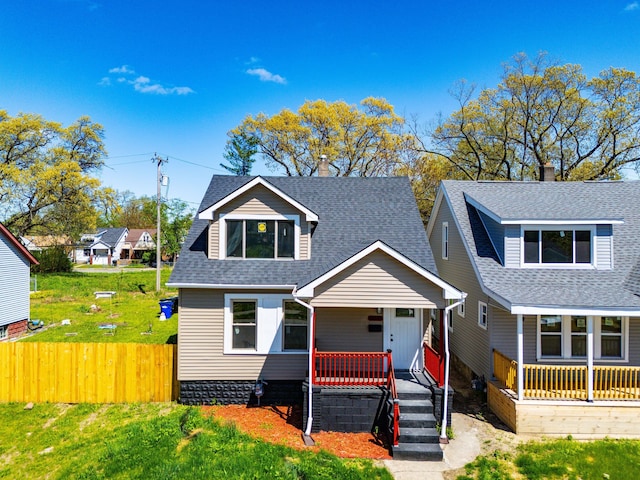 bungalow-style house featuring a porch and a shingled roof