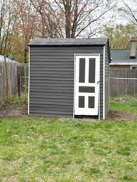 view of shed with a fenced backyard