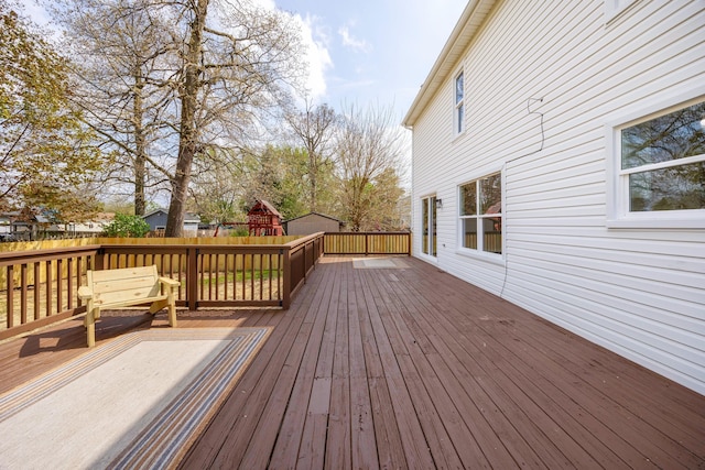 wooden terrace featuring a fenced backyard