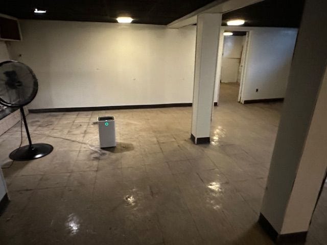 finished below grade area with tile patterned floors and baseboards