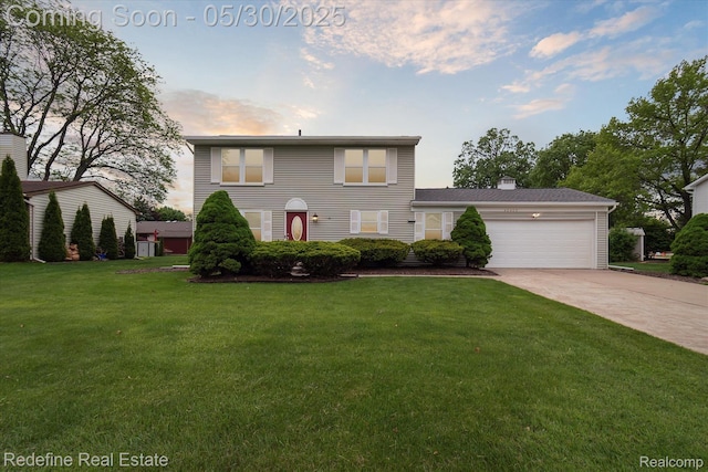 40409 Oak Tree, Novi, MI 48375 - view of front of home with a garage, driveway, a front lawn, and a chimney