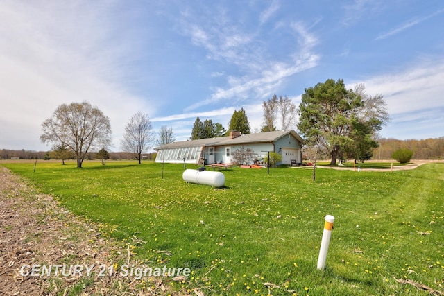 view of yard featuring a garage