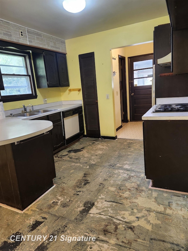 12595 Brant Rd, Saginaw, MI 48655 - kitchen with a sink, white dishwasher, healthy amount of natural light, and light countertops