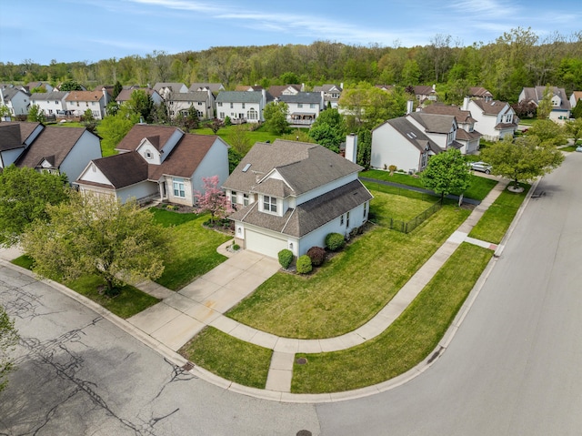 aerial view of residential area with a heavily wooded area