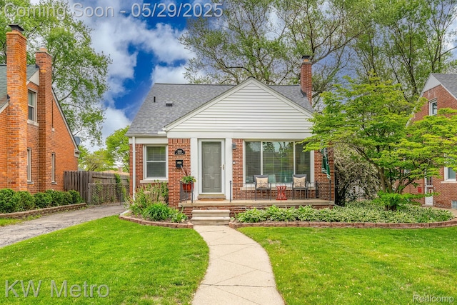 1930 N Wilson Ave, Royal Oak, MI 48073 - bungalow-style house featuring brick siding, a porch, roof with shingles, and a chimney
