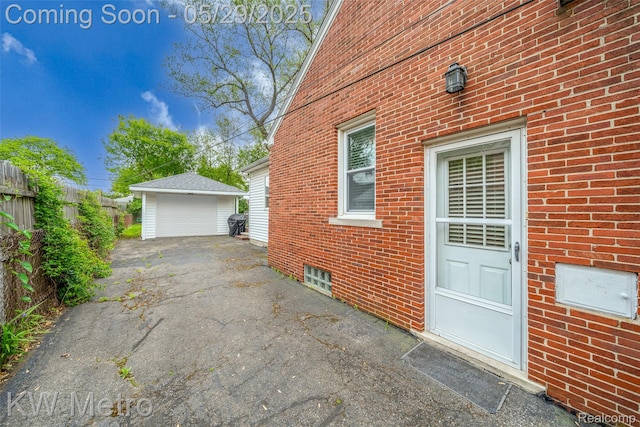 1930 N Wilson Ave, Royal Oak, MI 48073 - view of property exterior with a garage, an outdoor structure, and brick siding