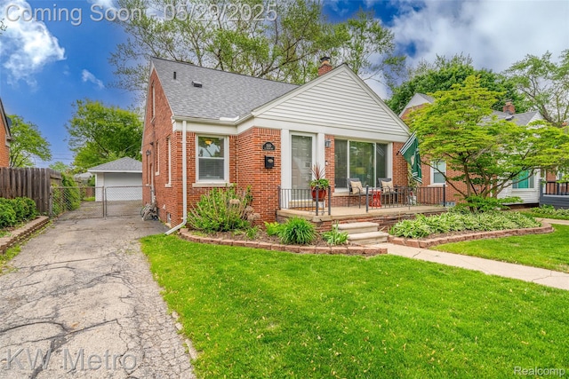 1930 N Wilson Ave, Royal Oak, MI 48073 - bungalow with brick siding, a chimney, an outbuilding, a shingled roof, and a garage