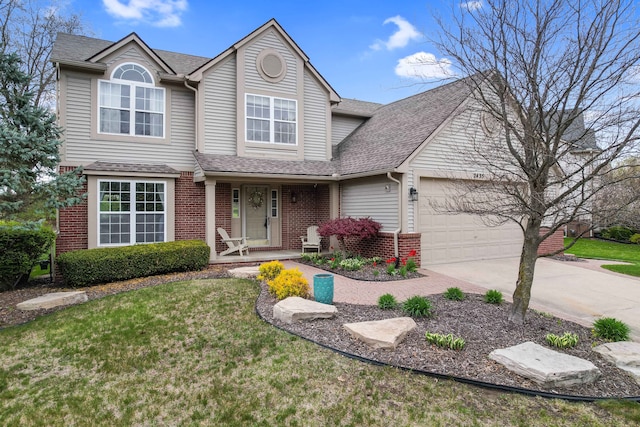 2435 Ivy Hill Dr, Commerce Twp, MI 48382 - traditional-style house with roof with shingles, an attached garage, brick siding, concrete driveway, and a front lawn