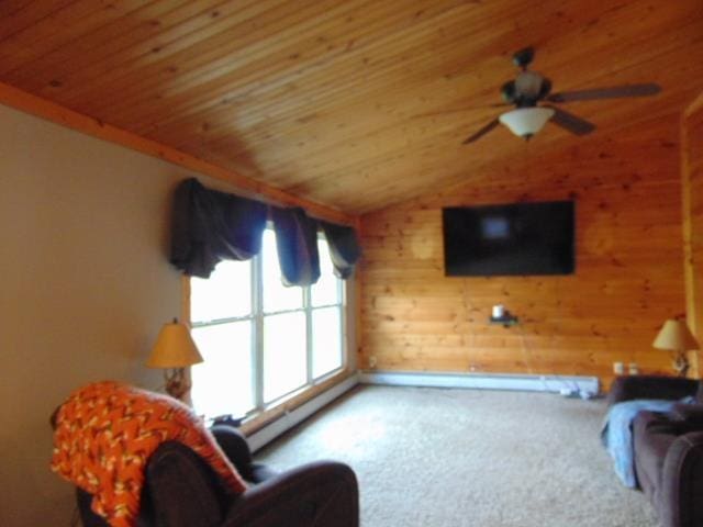 living room featuring carpet floors, vaulted ceiling, wooden ceiling, wood walls, and a ceiling fan