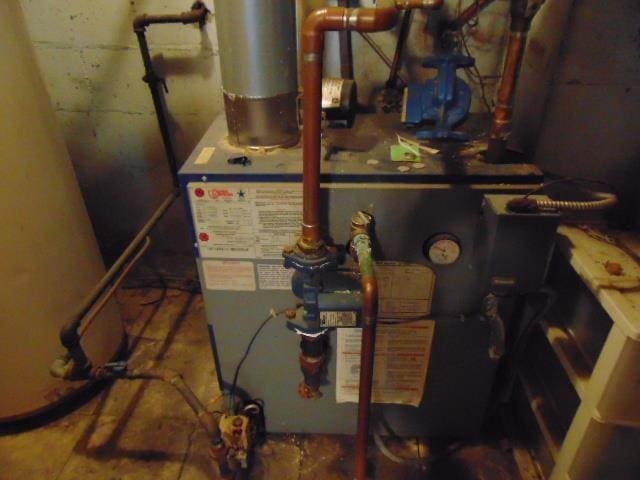 utility room with water heater