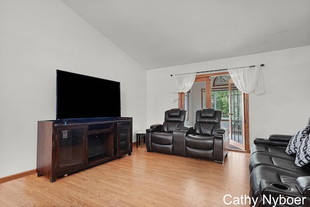 4330 Aspen Trails Dr NE, Grand Rapids, MI 49546 - living area featuring light wood-style floors, vaulted ceiling, and baseboards