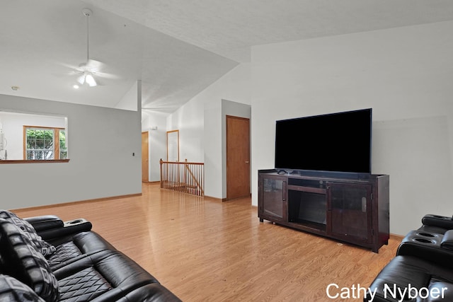 4330 Aspen Trails Dr NE, Grand Rapids, MI 49546 - living room featuring wood finished floors, lofted ceiling, and a ceiling fan