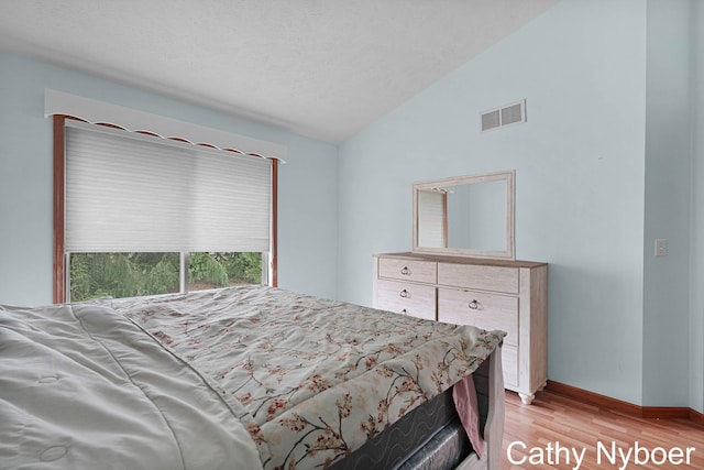 4330 Aspen Trails Dr NE, Grand Rapids, MI 49546 - bedroom featuring vaulted ceiling, light wood-type flooring, and baseboards