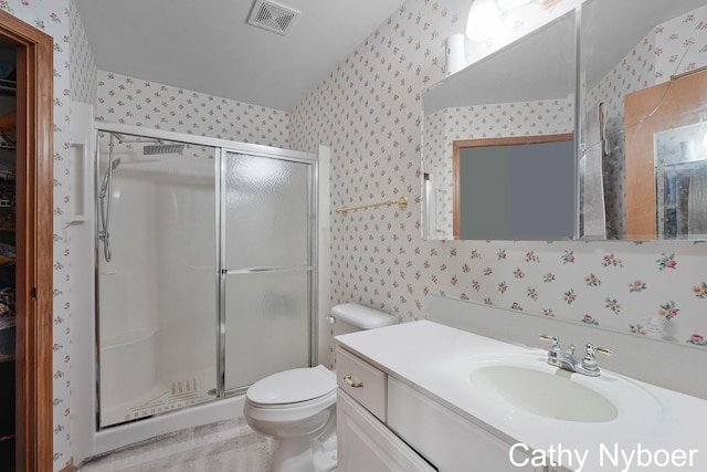 4330 Aspen Trails Dr NE, Grand Rapids, MI 49546 - bathroom with wallpapered walls, a shower stall, vanity, and toilet