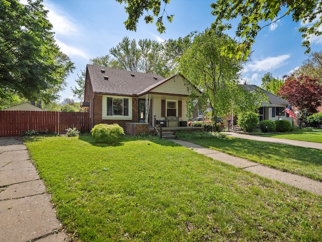 bungalow featuring brick siding, a shingled roof, and covered porch