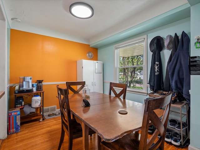 dining room featuring light wood-style floors