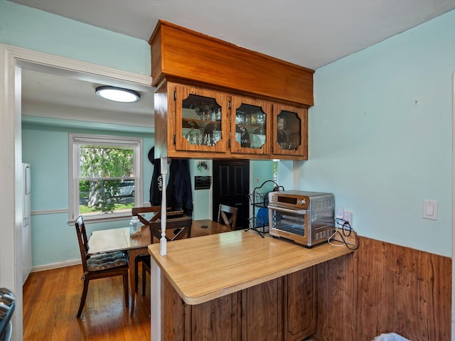 office area with wood finished floors and baseboards