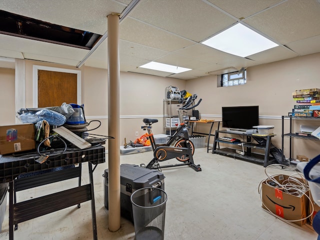exercise room with a drop ceiling