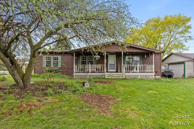 16617 W Stanton Rd, Pierson, MI 49339 - ranch-style home featuring a front yard, an outdoor structure, and covered porch