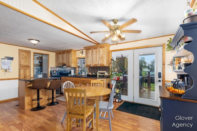 16617 W Stanton Rd, Pierson, MI 49339 - dining room featuring ceiling fan, light wood-type flooring, and a textured ceiling