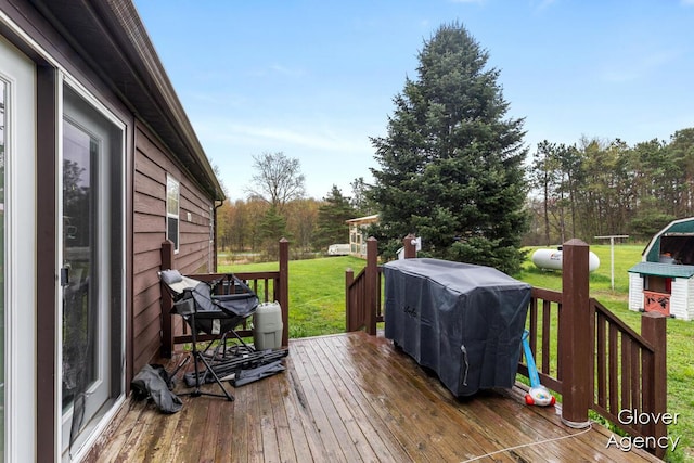16617 W Stanton Rd, Pierson, MI 49339 - wooden terrace featuring a lawn