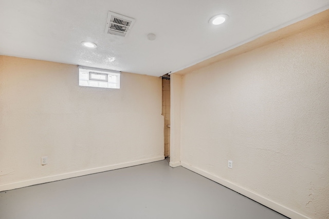 below grade area with recessed lighting and baseboards