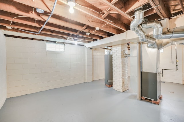 basement featuring water heater and heating unit