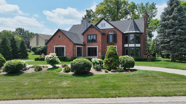 1947 Maplewood Ave, Bloomfield Hills, MI 48302 - english style home featuring brick siding, a chimney, and a front lawn