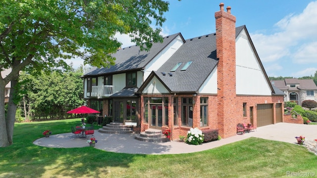 1947 Maplewood Ave, Bloomfield Hills, MI 48302 - rear view of property with a chimney, brick siding, a yard, a balcony, and concrete driveway