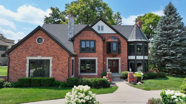 1947 Maplewood Ave, Bloomfield Hills, MI 48302 - english style home with a chimney and brick siding