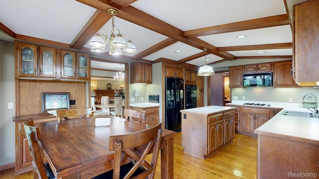 1947 Maplewood Ave, Bloomfield Hills, MI 48302 - kitchen featuring black appliances, light wood finished floors, a center island, light countertops, and glass insert cabinets