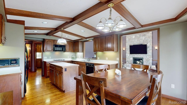 1947 Maplewood Ave, Bloomfield Hills, MI 48302 - kitchen featuring black appliances, light countertops, a chandelier, light wood finished floors, and a kitchen island