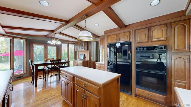 1947 Maplewood Ave, Bloomfield Hills, MI 48302 - kitchen with black appliances, brown cabinetry, a center island, light countertops, and decorative light fixtures
