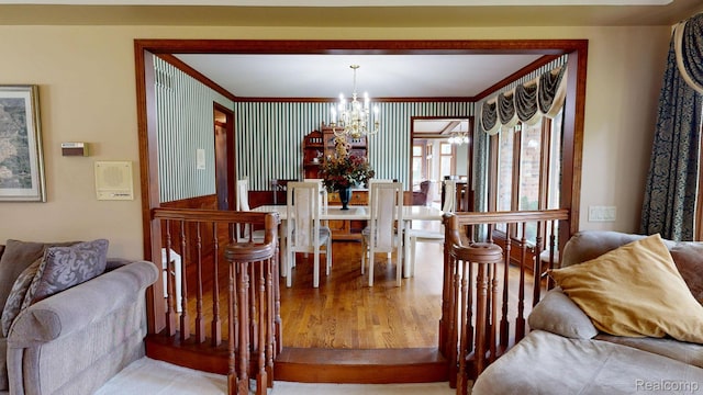 1947 Maplewood Ave, Bloomfield Hills, MI 48302 - dining space featuring a chandelier, wood finished floors, and ornamental molding