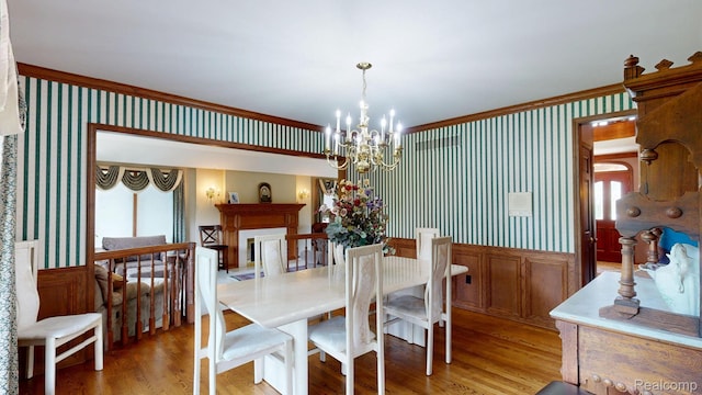 1947 Maplewood Ave, Bloomfield Hills, MI 48302 - dining room with a chandelier, light wood-style flooring, wallpapered walls, and plenty of natural light