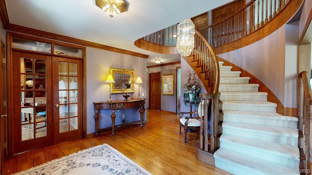1947 Maplewood Ave, Bloomfield Hills, MI 48302 - entryway with stairs, wood finished floors, french doors, and crown molding