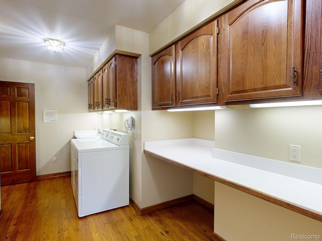 1947 Maplewood Ave, Bloomfield Hills, MI 48302 - washroom featuring cabinet space, light wood-type flooring, and washing machine and dryer