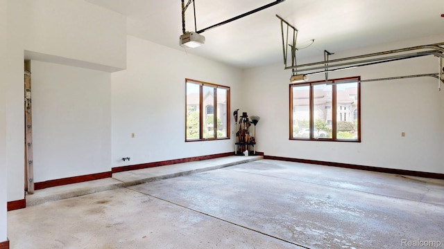 1947 Maplewood Ave, Bloomfield Hills, MI 48302 - garage with baseboards and a garage door opener