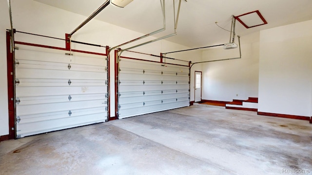 1947 Maplewood Ave, Bloomfield Hills, MI 48302 - garage with baseboards and a garage door opener