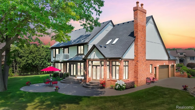1947 Maplewood Ave, Bloomfield Hills, MI 48302 - back of house with a chimney, a yard, brick siding, roof with shingles, and concrete driveway