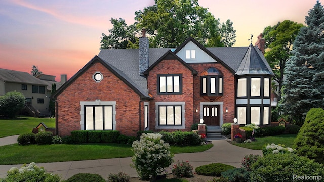 1947 Maplewood Ave, Bloomfield Hills, MI 48302 - english style home with a chimney, brick siding, and a front lawn