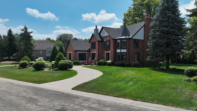 1947 Maplewood Ave, Bloomfield Hills, MI 48302 - view of front facade with a chimney, a front yard, and brick siding