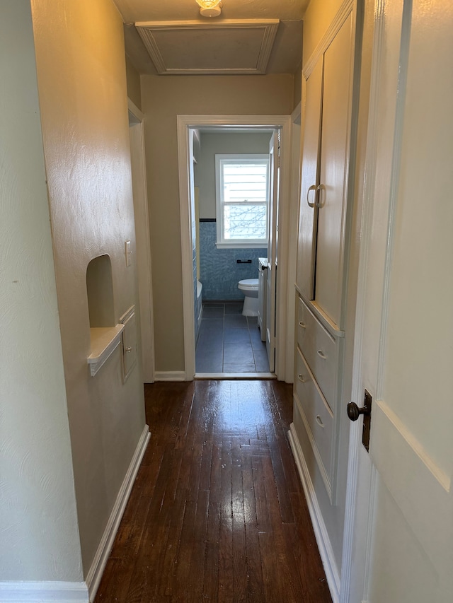 609 Buckingham Ave, Flint, MI 48507 - corridor with dark wood-style floors, baseboards, and attic access