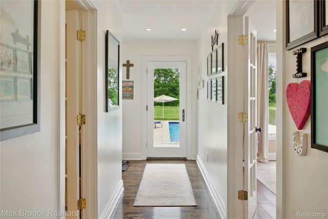 187 Darwin Rd, Pinckney, MI 48169 - doorway to outside with dark wood-style floors and baseboards
