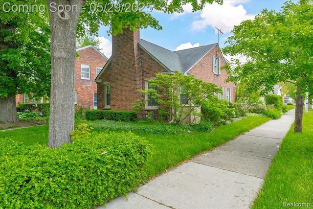 4800 Bishop St, Detroit, MI 48224 - view of home's exterior with brick siding and a chimney