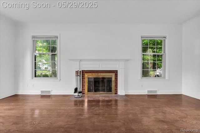 4800 Bishop St, Detroit, MI 48224 - unfurnished living room featuring plenty of natural light, crown molding, and a brick fireplace