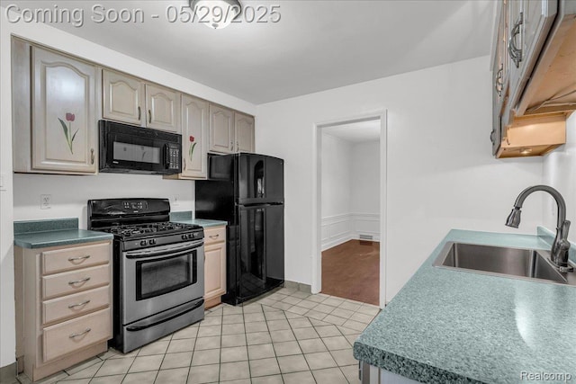 4800 Bishop St, Detroit, MI 48224 - kitchen featuring black appliances, a sink, and light tile patterned floors