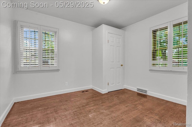 4800 Bishop St, Detroit, MI 48224 - unfurnished room with wood finished floors, baseboards, and crown molding